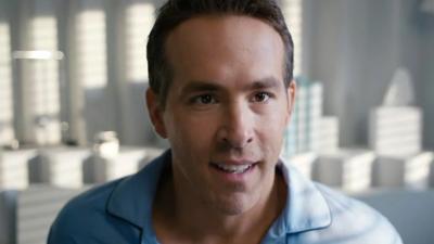 Ryan Reynolds wearing blue pyjamas in a scene from Free Guy