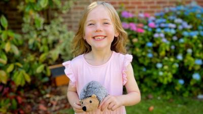 Girl writes "I love you" note for hedgehog