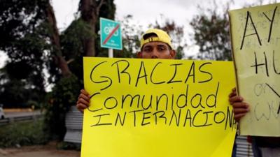 Man holding placard