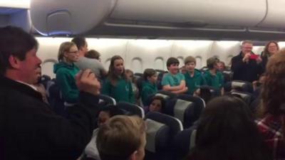 Choir singing on plane