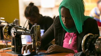 Woman with sewing machine