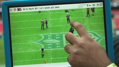 A tablet in use at an NFL game