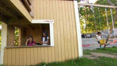 Children playing inside one of Sweden's immigration camps