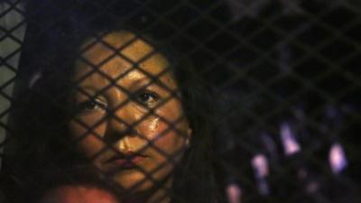 Guadalupe Garcia de Rayos is locked in a van that is stopped in the street by protesters outside the Immigration and Customs Enforcement facility on 8 February 2017, in Phoenix.