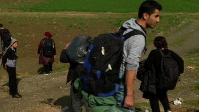 Migrants walking to the Macedonian border