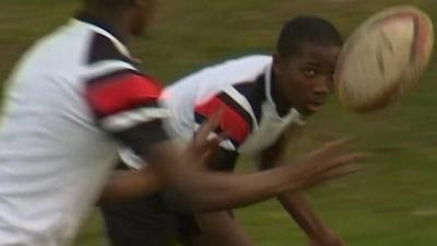 Boys playing rugby