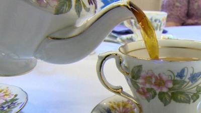 Teapot pouring tea