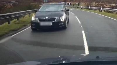 Driver narrowly avoids a head-on crash