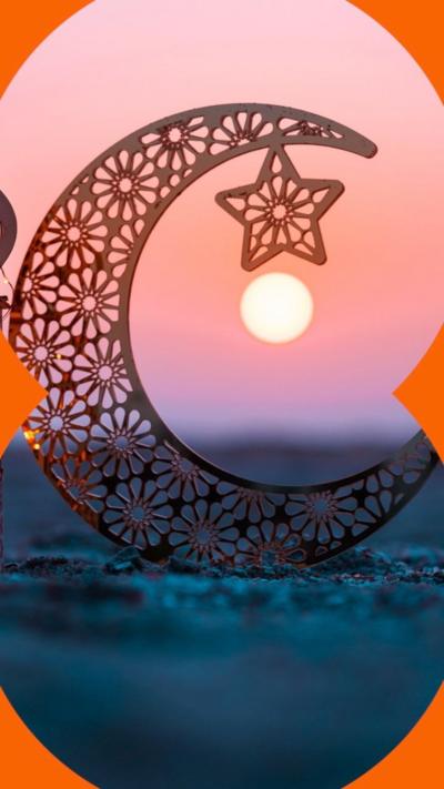 A crescent moon and star outline with a setting sun behind.