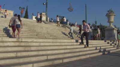 Mark Lobel on steps in Greece