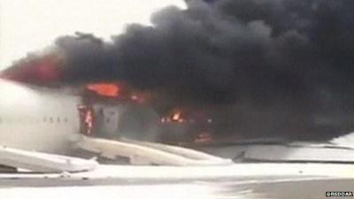 Plane on fire on Dubai runway
