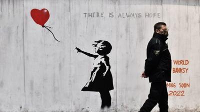 Banksy mural with heart balloon