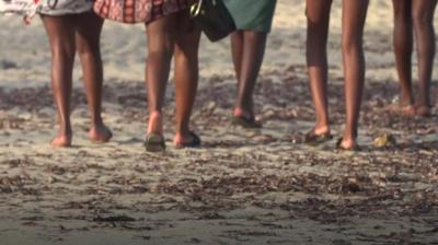 people walking on beach