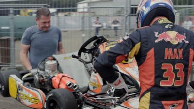 Jos and Max Verstappen carry a go kart