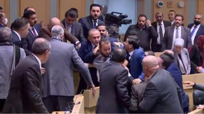 MPs fighting in Jordan's parliament