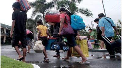 People in Philippines take shelter