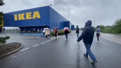 Hundreds of shoppers braved the rain in Glasgow to queue as Ikea reopens stores across Scotland.