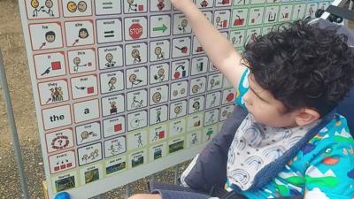 Cohen using language board