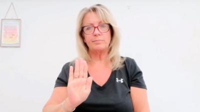 Woman communicating in Makaton