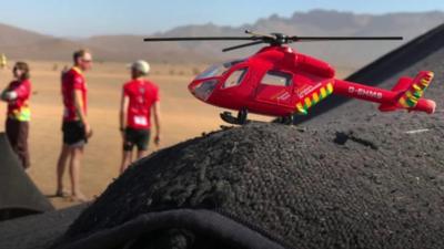 Model air amubulance in Sahara desert