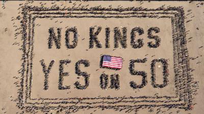 Aerial picture shows protesters forming a human banner during the No Kings rally in San Francisco, California on 18 October 2025 
