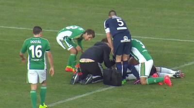 Injured player surrounded by other players