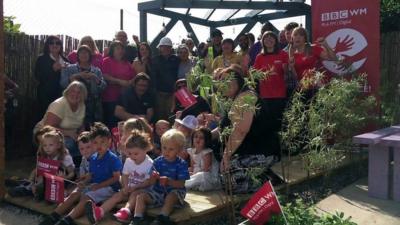 Volunteers and locals in the new community garden