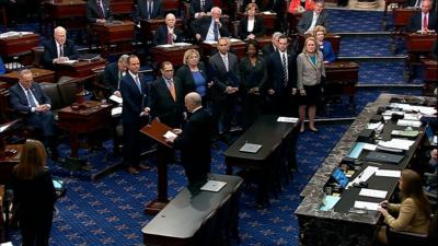 The US Senate’s sergeant at arms demands silence from senators as the historic proceedings begin.