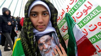 Iranian girl attends rally in Tehran to mark the 40th anniversary of the Islamic Revolution