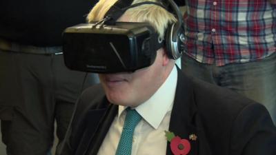 Boris Johnson wearing simulator glasses