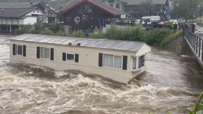 A caravan floating down a river