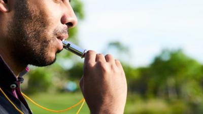 Man using a whistle