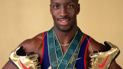 Michael Johnson says wearing gold shoes put more pressure on him