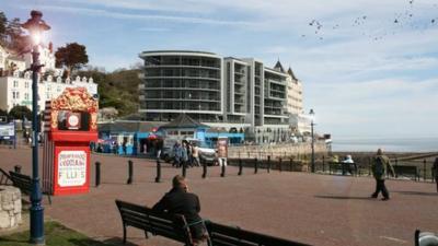 The pier pavilion site occupies a grand view across Llandudno town