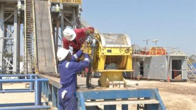 Workers drilling the well in Zimbabwe