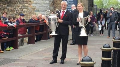 Iand Rush and Jayne Ludlow with the UCL and UWCL trophies