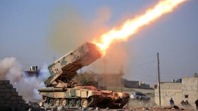 Iraqi rocket launcher firing towards IS lines