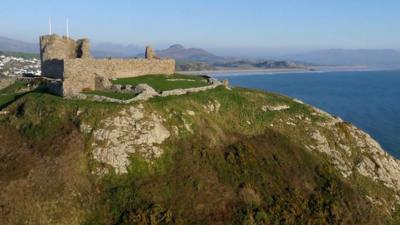 A castle overlooking the sea in Wales