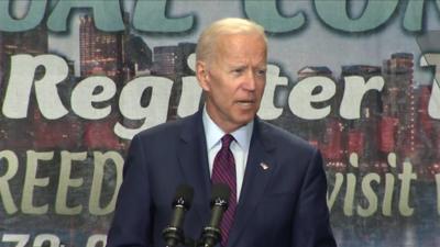 Joe Biden speaking on stage