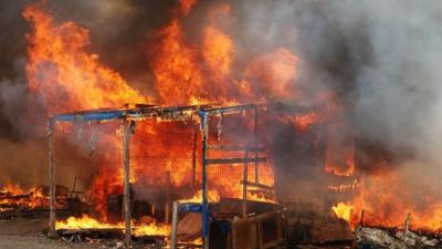 A fire at the "Jungle" migrant camp in Calais, northern France.