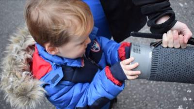 Young boy with air filter device