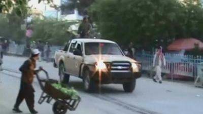 Man crossing road on Kunduz city street