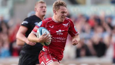 Sam Costelow of Scarlets races in to score against Ospreys