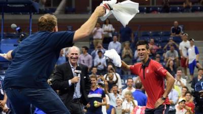 Novak Djokovic dances with fan