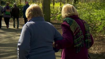 Elderly women walking in park