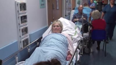 Patient in hospital corridor