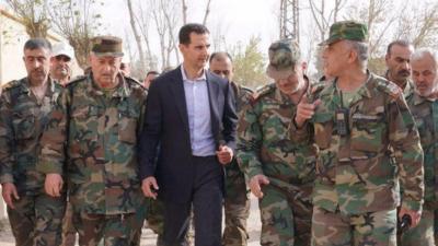 Bashar al-Assad and soldiers