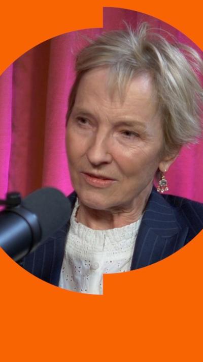 Julia Samuel speaking into a microphone