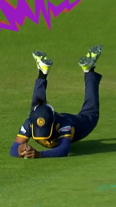 Nilakshi de Silva on the floor clasping the cricket ball 