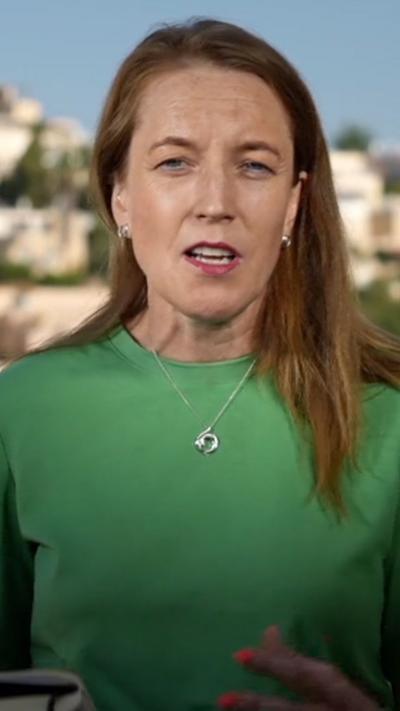 Close-up of correspondent Yolande Knell wearing a green top